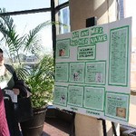 Student stops to read poster presentation